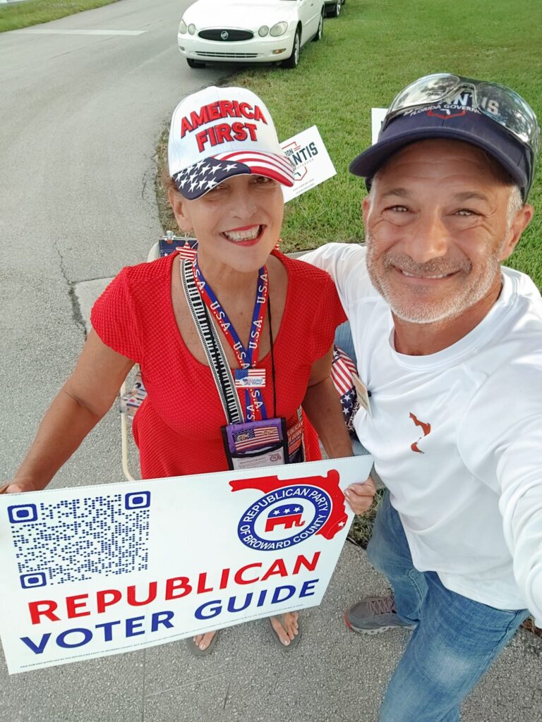 Volunteers holding a Republican voter guide